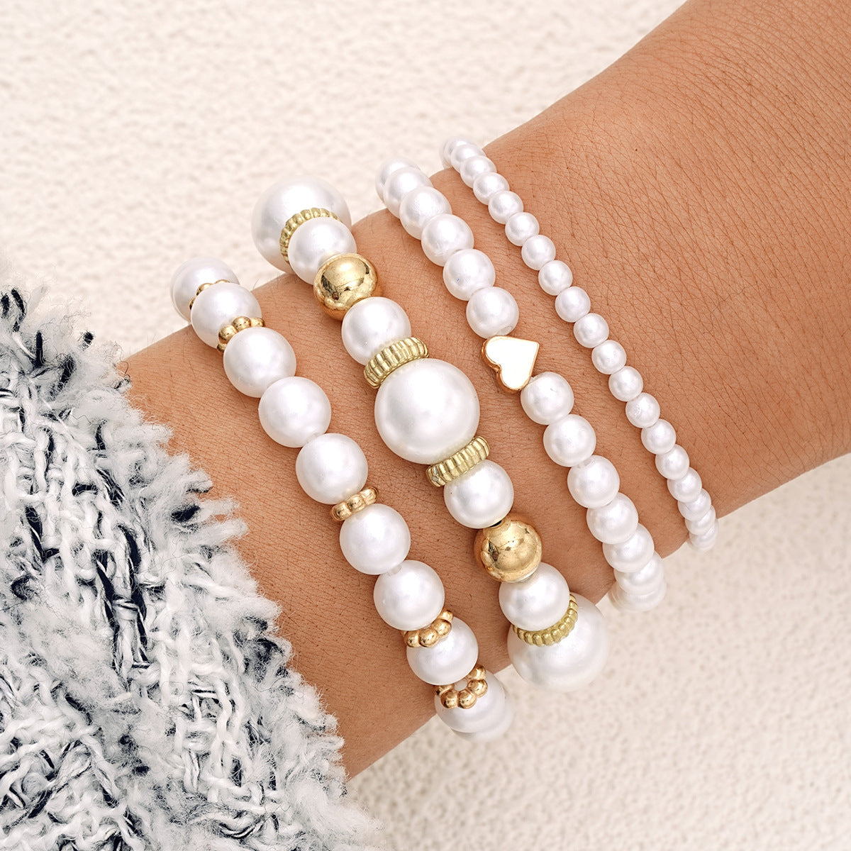 Conjunto de pulseras con corazón de perla blanca