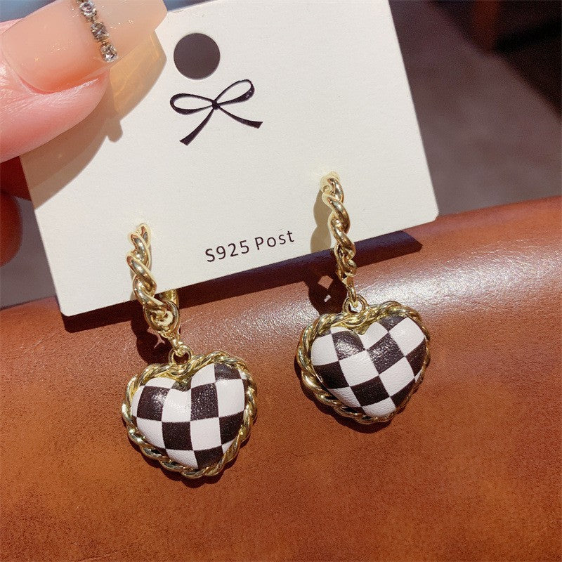 Black leather heart checkerboard stud earrings