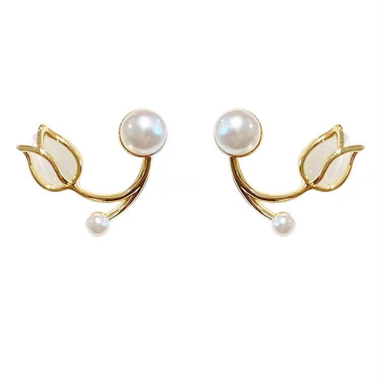 A pair of tulip flower pearl stud earrings.