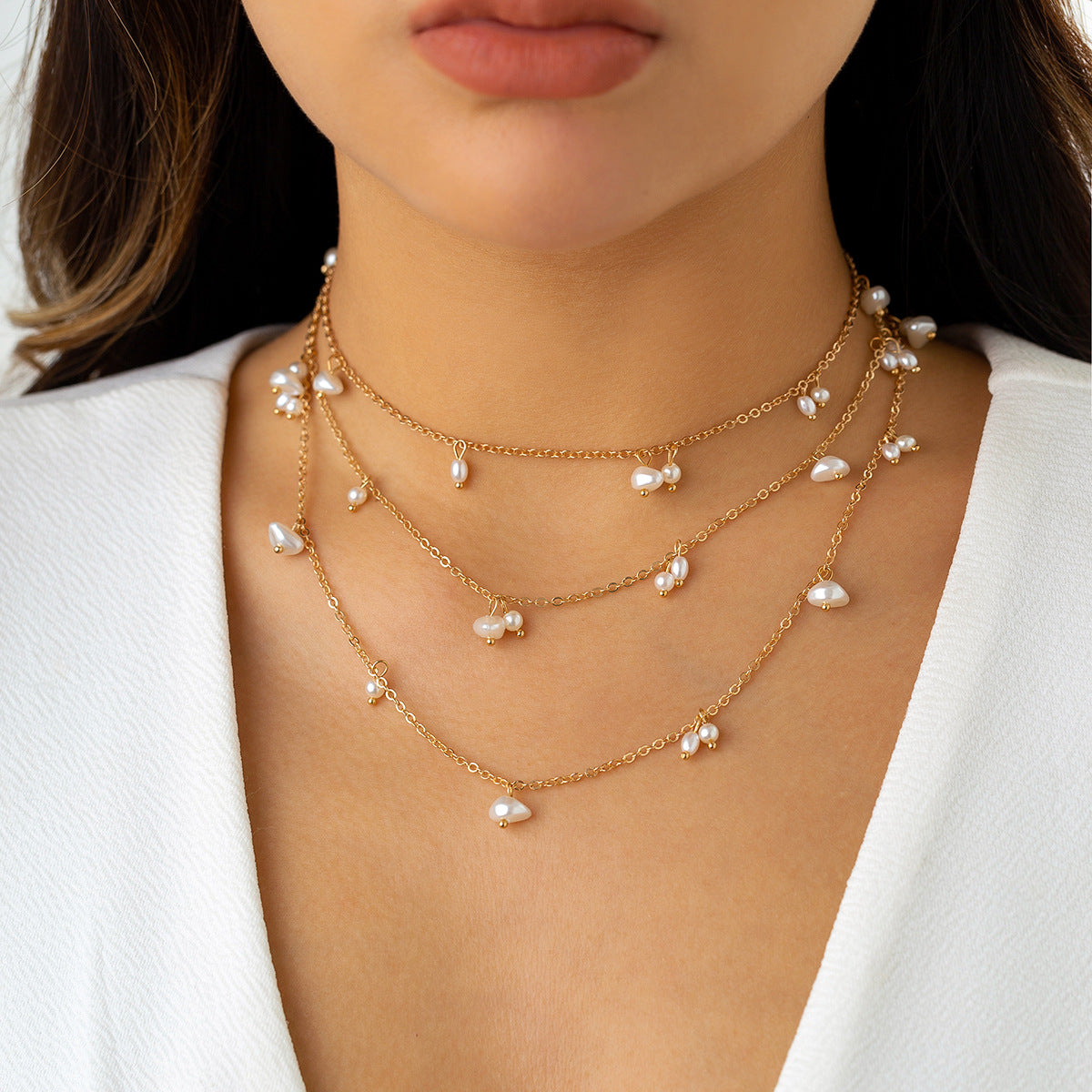 Apila collares de perlas largos