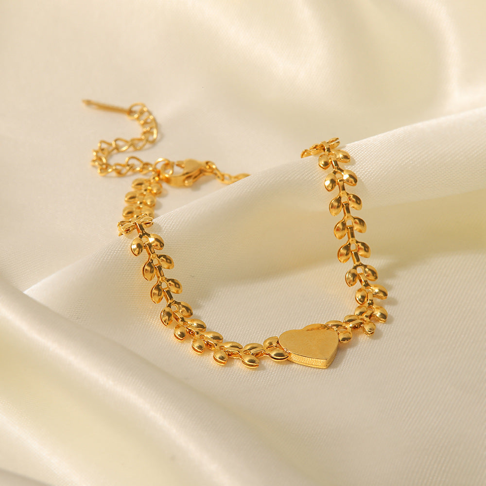 Pulsera de acero de titanio con corazón de amor y conchas marinas