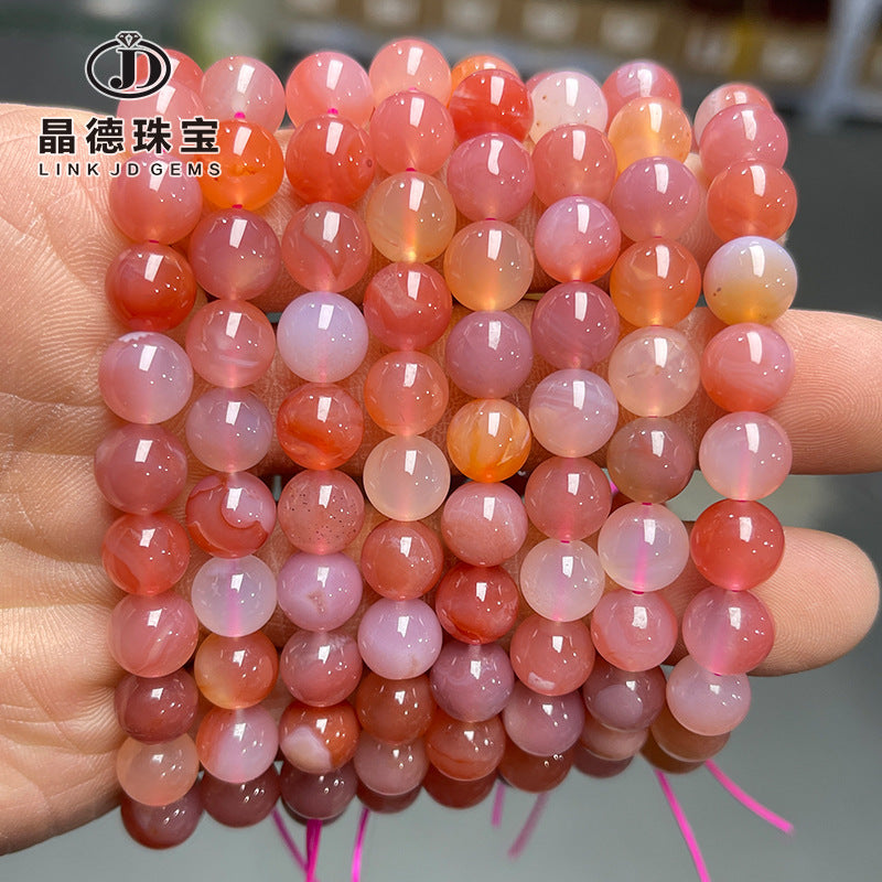 Pulsera de cuentas redondas de ágata con fuente de sal de melocotón