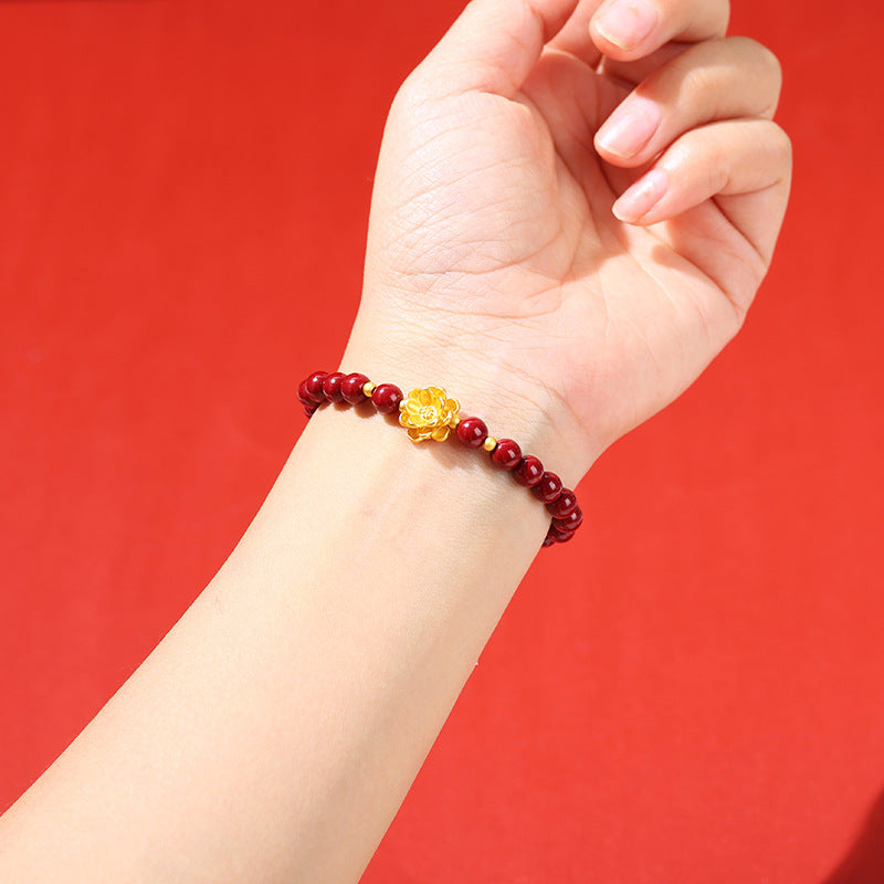 Pulsera de loto de metal arena dorada morada.
