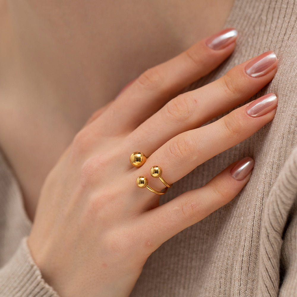 Anillo abierto tres bolas oro