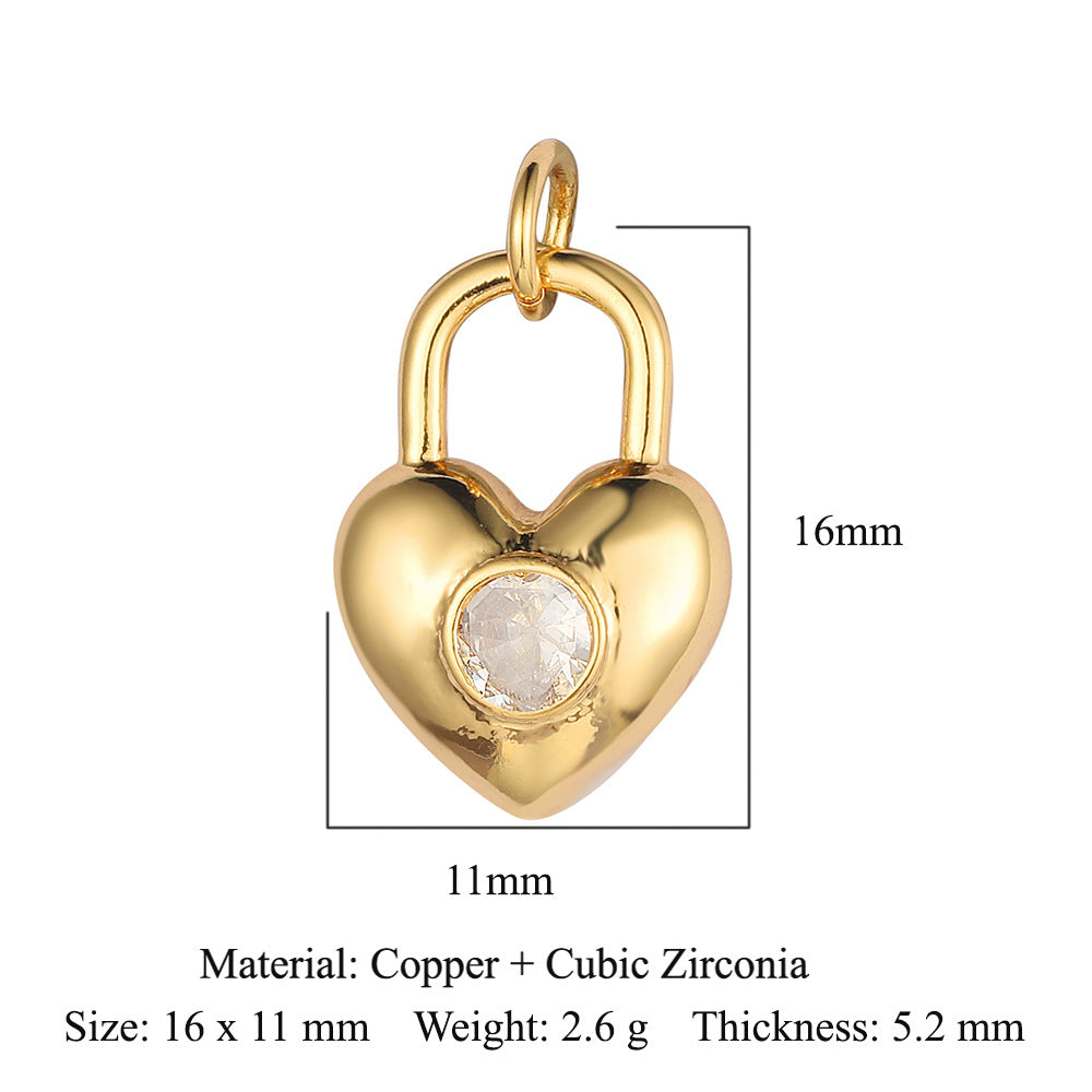 Colgante de cobre y circonita con forma de llave y corazón de melocotón