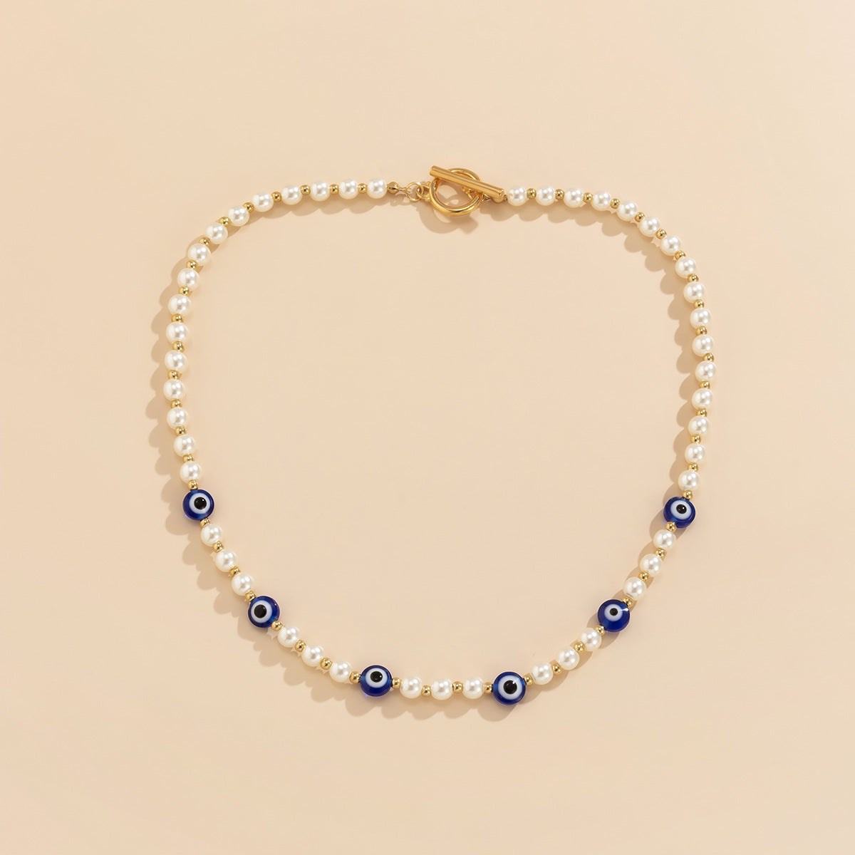 Collar de ojo de perla de imitación empalmado