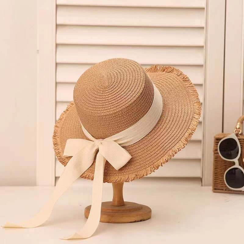 Sombrero de paja con lazo de tendencia para mujer, sombrero de ala plana tejido para vacaciones de verano