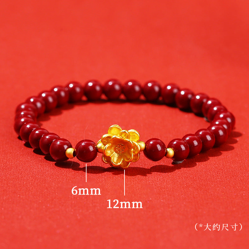 Pulsera de loto de metal arena dorada morada.
