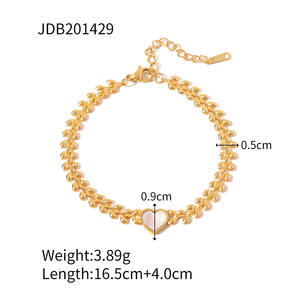 Pulsera de acero de titanio con corazón de amor y conchas marinas
