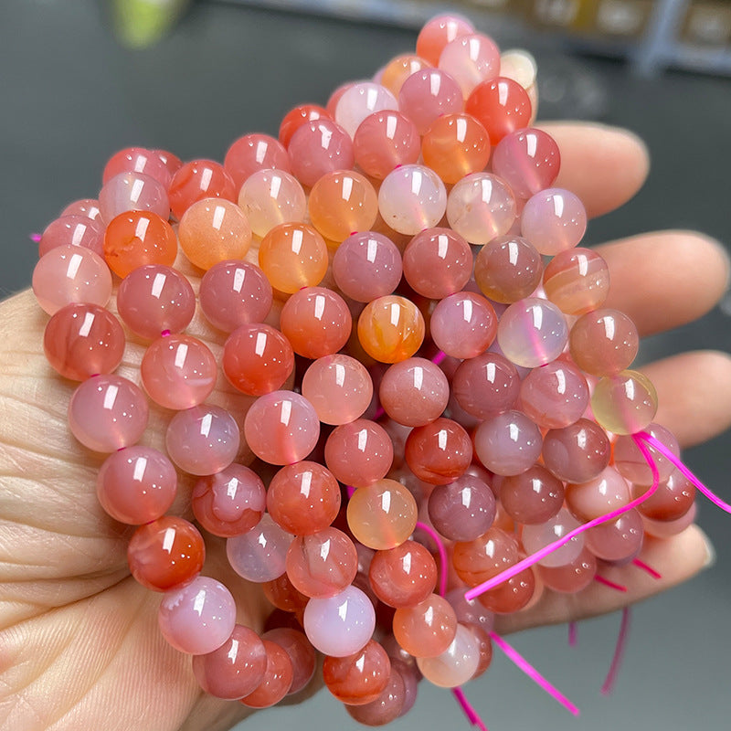 Pulsera de cuentas redondas de ágata con fuente de sal de melocotón