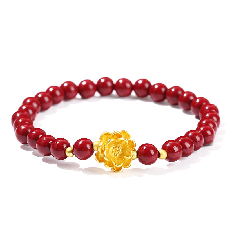 Pulsera de loto de metal arena dorada morada.