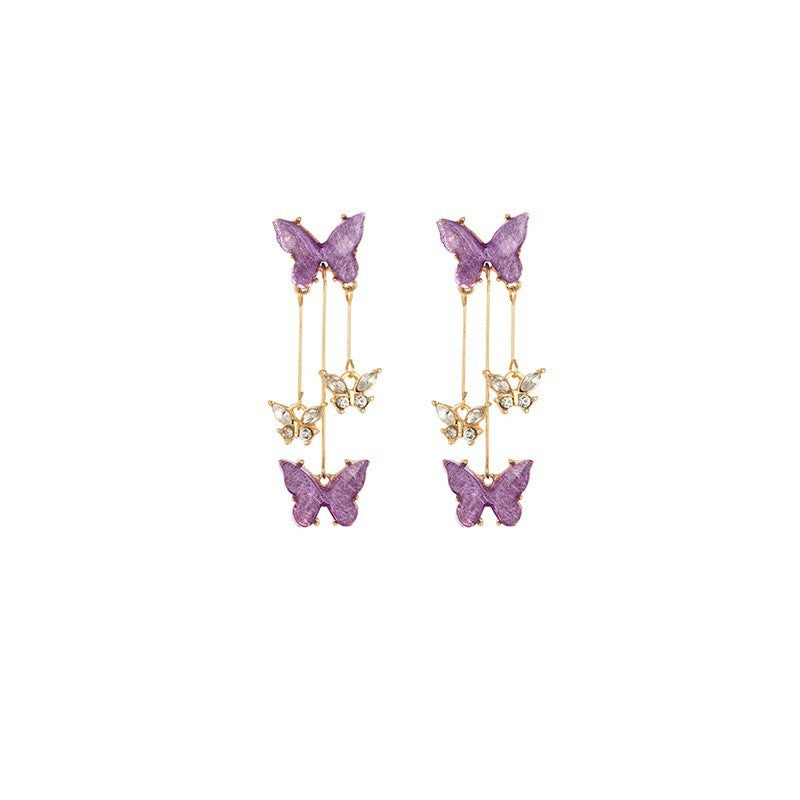 Pendientes largos con flecos de mariposa morada