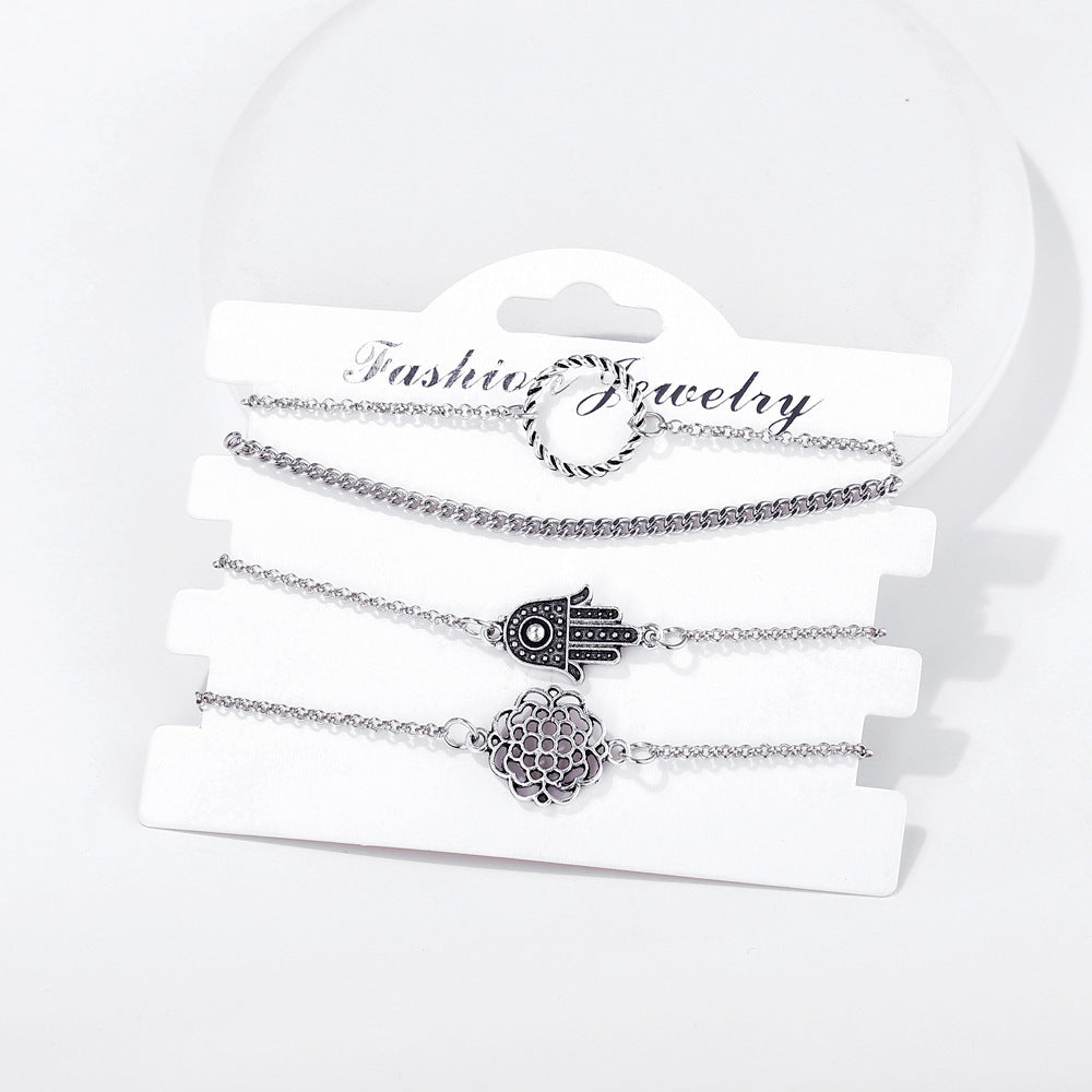 Conjunto de cuatro piezas de pulseras trenzadas con diseño de palmeras huecas 