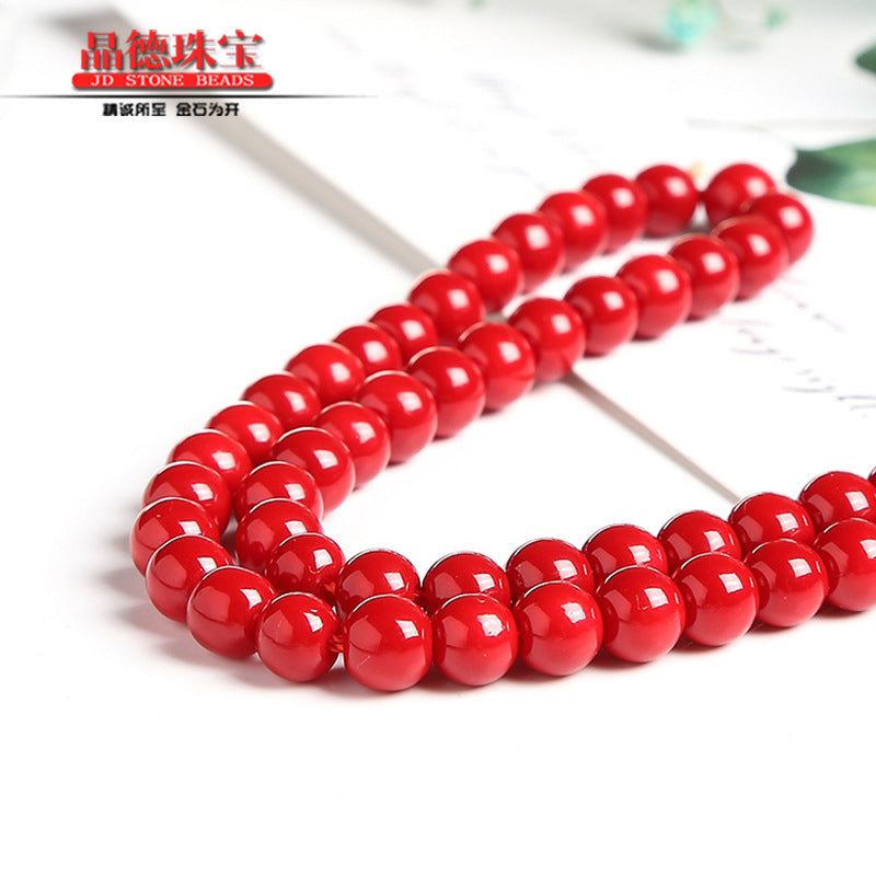 Perlas sintéticas lacadas en rojo 
