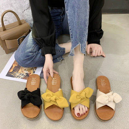 Bow slippers are worn by women in summer