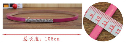 Gold buckle patent leather thin belt