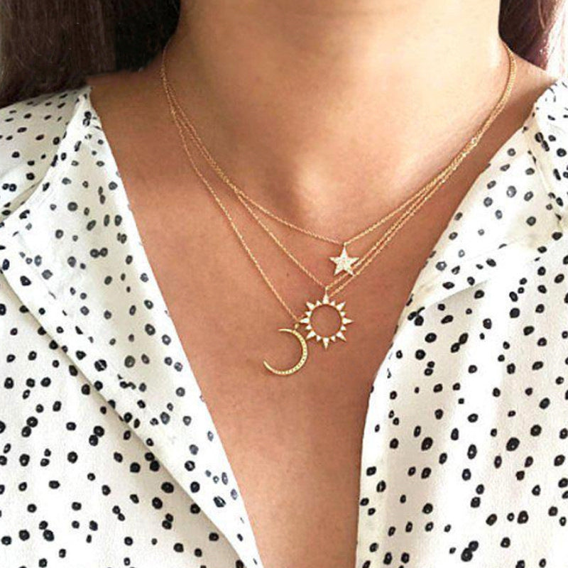 Diamond sun, star and moon pendant necklace
