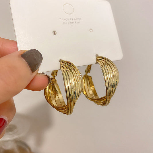 Pendientes de anillo de torsión con nuevo temperamento y aguja de plata S925 