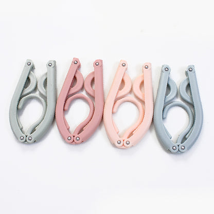 Perchas plegables de plástico portátiles 