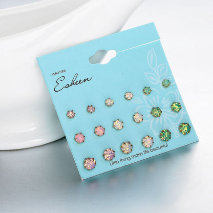 9 pairs of earrings in different sizes and colors