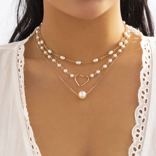Stacked imitation pearl hollow love necklace