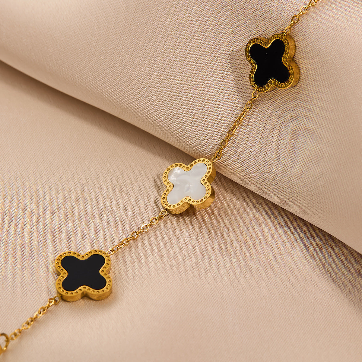 Black and white four-leaf clover titanium steel bracelet