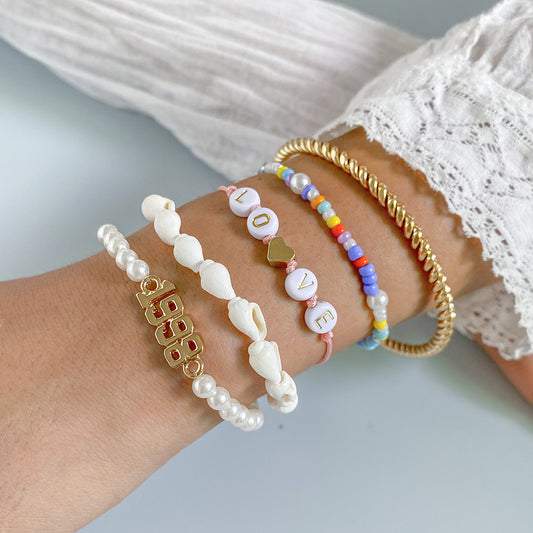 Stacked twist ring shell bracelet