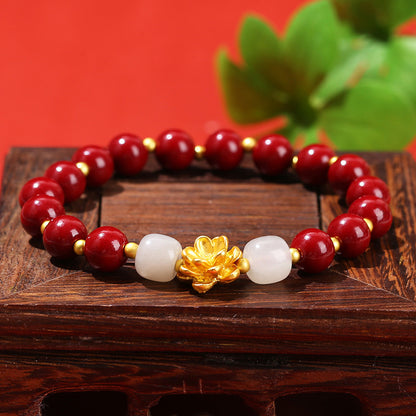 Pulsera de loto de metal arena dorada morada. 
