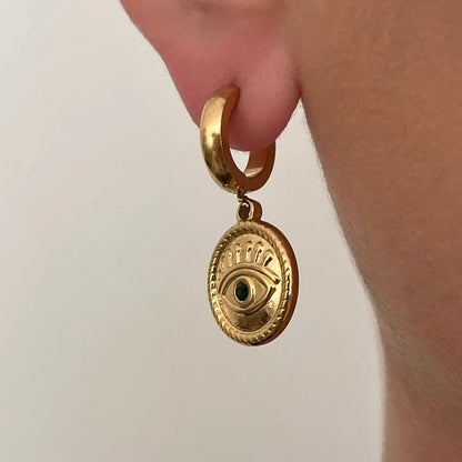 Eye pendant earrings