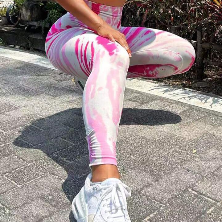 Pantalones de yoga color melocotón sin costuras con efecto tie-dye 