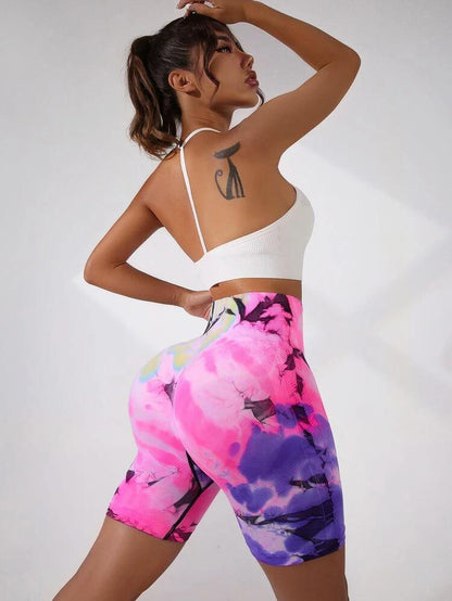Pantalones cortos de yoga europeos sin costuras con efecto tie-dye color melocotón y levantamiento de glúteos 