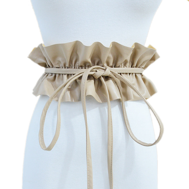 Elastic pleated edge belt