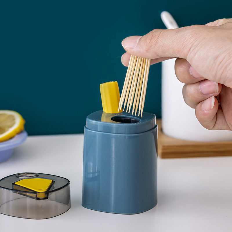 Soporte para palillos de dientes que se presiona para dispensar 