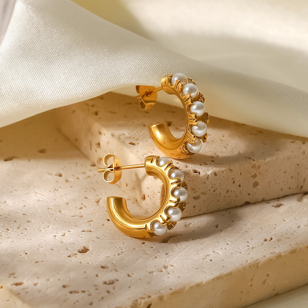 Pearl inlaid C-shaped earrings