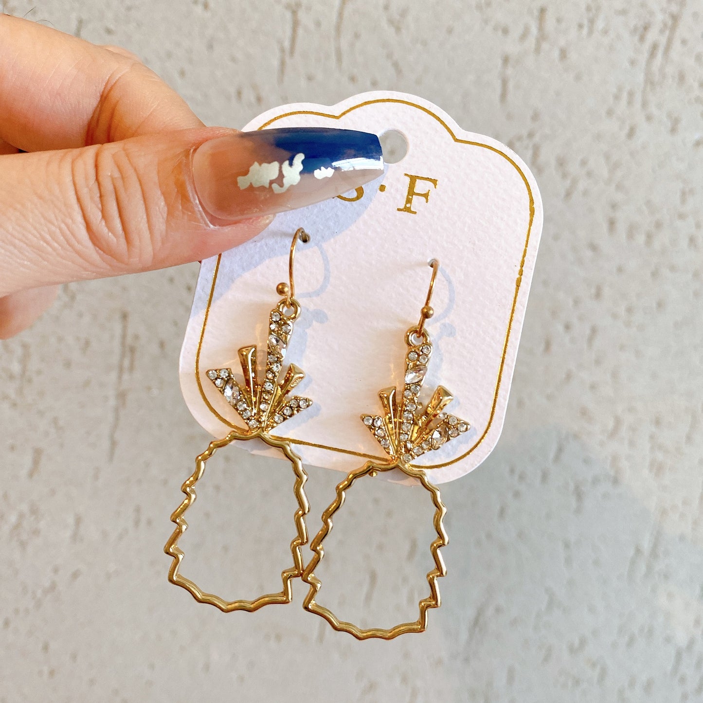 Gold hollow pineapple earrings