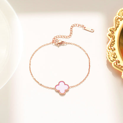 Pulseira feminina em aço titânio - trevo preto e branco, corrente em ouro rosa 