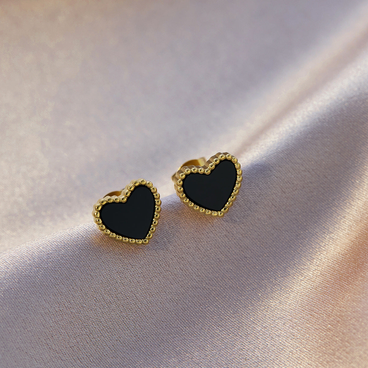 Four-leaf clover titanium steel ear buckle