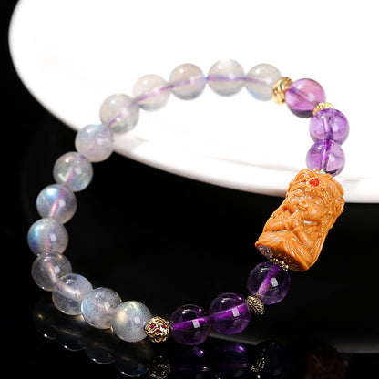 Gray moonstone and amethyst sandalwood Tara bracelet.