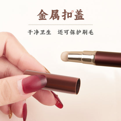 Pincel labial retráctil morado 
