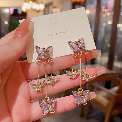 Pendientes largos con flecos de mariposa morada 