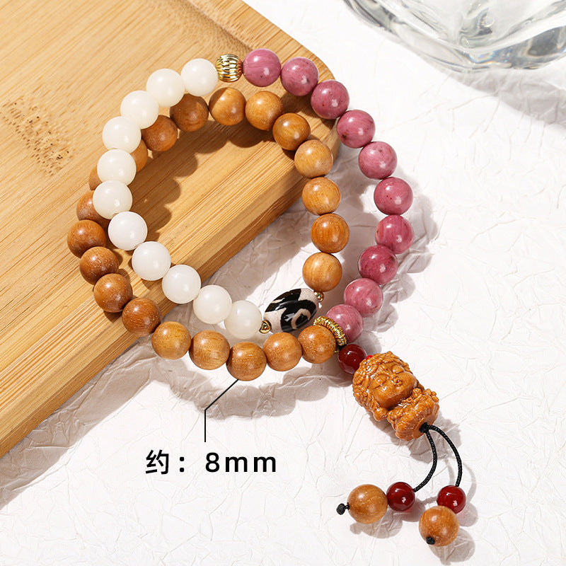 Pulsera de doble anillo con piedra roja Bodhi y jade blanco. 