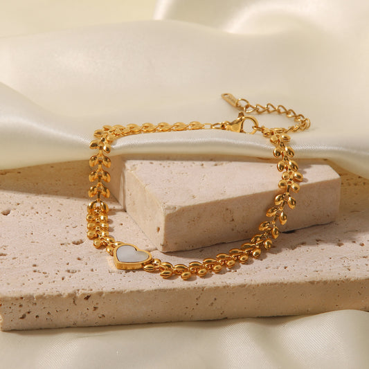Pulsera de acero de titanio con corazón de amor y conchas marinas 