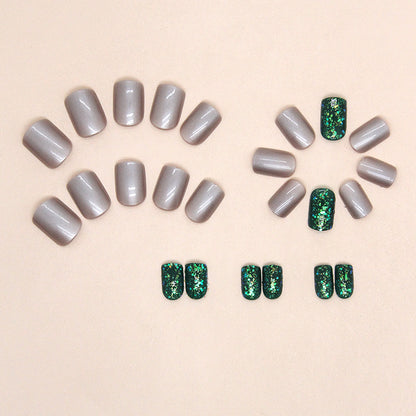 Uñas postizas cuadradas cortas con purpurina Aurora en color verde oscuro 