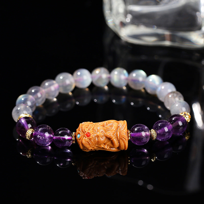 Gray moonstone and amethyst sandalwood Tara bracelet.