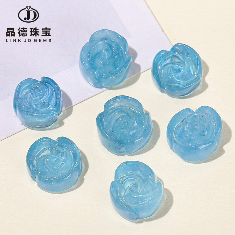 Aquamarine engraved rose inlaid with loose beads