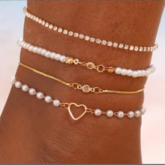 Juego de 4 tobilleras con corazón de circonita y perla 