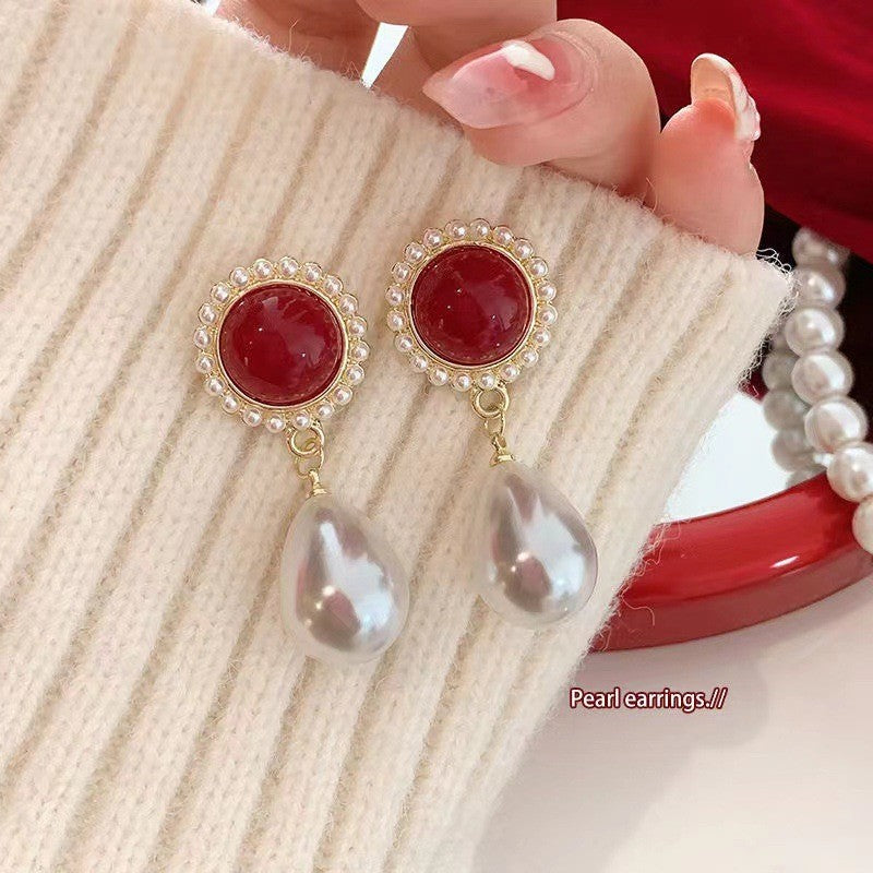Pendientes de perla ovalada roja 