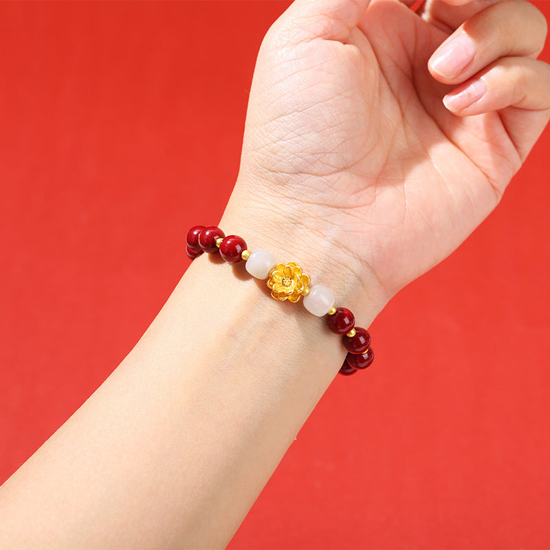Pulsera de loto de metal arena dorada morada. 