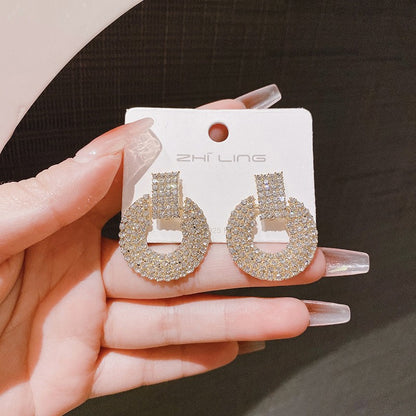 Diamond-encrusted geometric round earrings