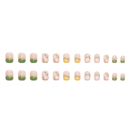 Uñas con diseño floral en tonos amarillo y verde para primavera y verano 